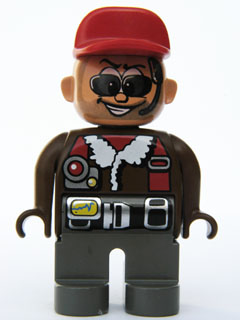 Duplo Figure, Male Action Wheeler, Dark Gray Legs, Brown Top with Aviator Jacket, Black Belt, Red Cap, Sunglasses, Headset with Microphone (4141904)