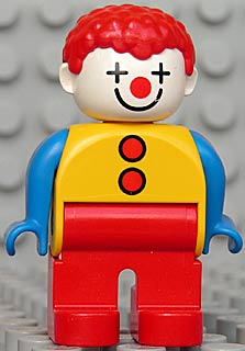 Duplo Figure, Male Clown, Red Legs, Yellow Top with 2 Buttons, Blue Arms, Red Hair Curly (4129940)